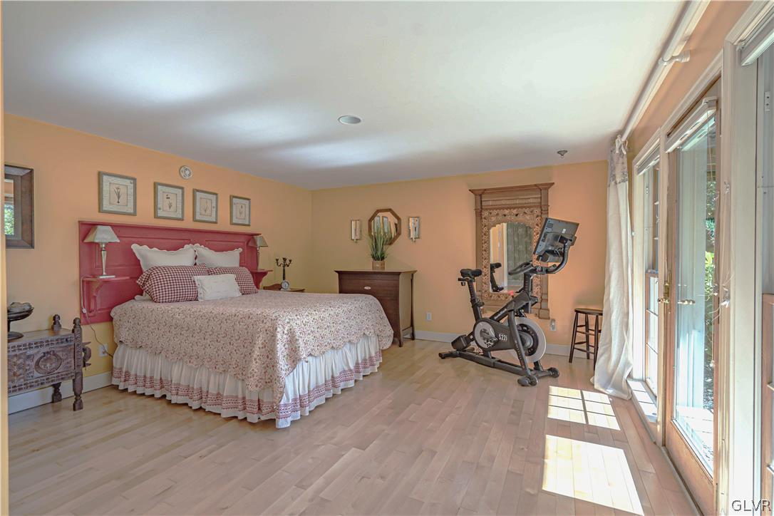 2884 Gallows Hill Road Riegelsville, PA 18077 - Photo 28 of 50 a bedroom with bed a table and a window