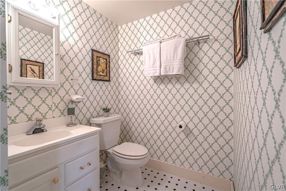 2884 Gallows Hill Road Riegelsville, PA 18077 - Photo 31 of 50 a bathroom with a toilet a sink and a bathtub