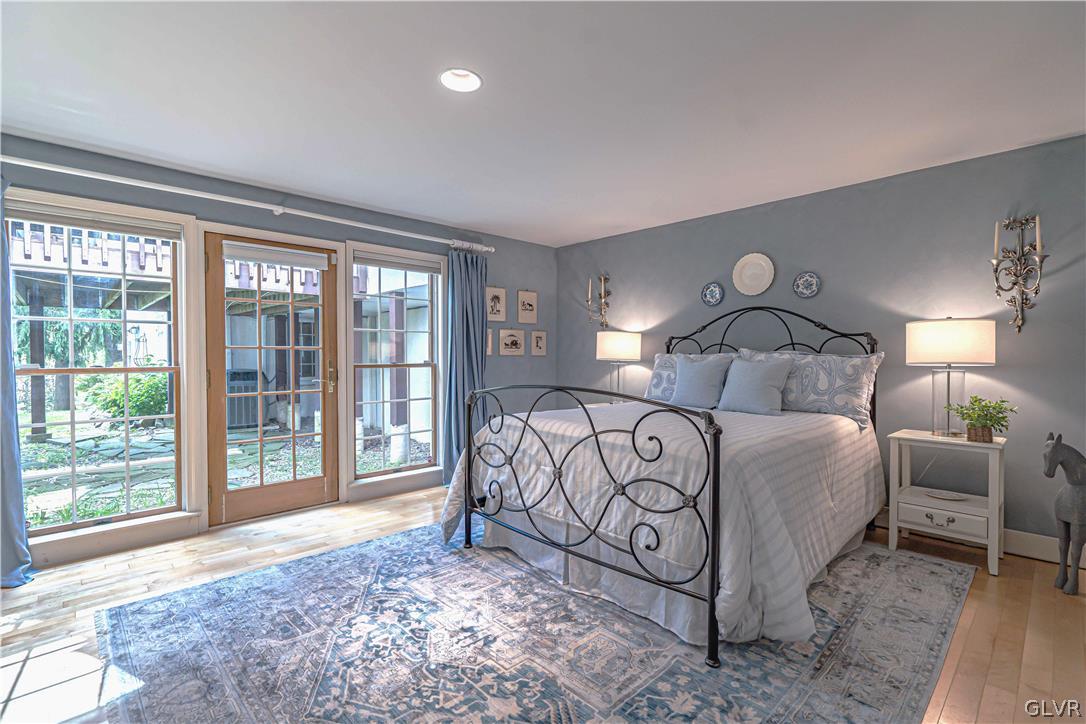 2884 Gallows Hill Road Riegelsville, PA 18077 - Photo 33 of 50 a bedroom with a large bed and a large window