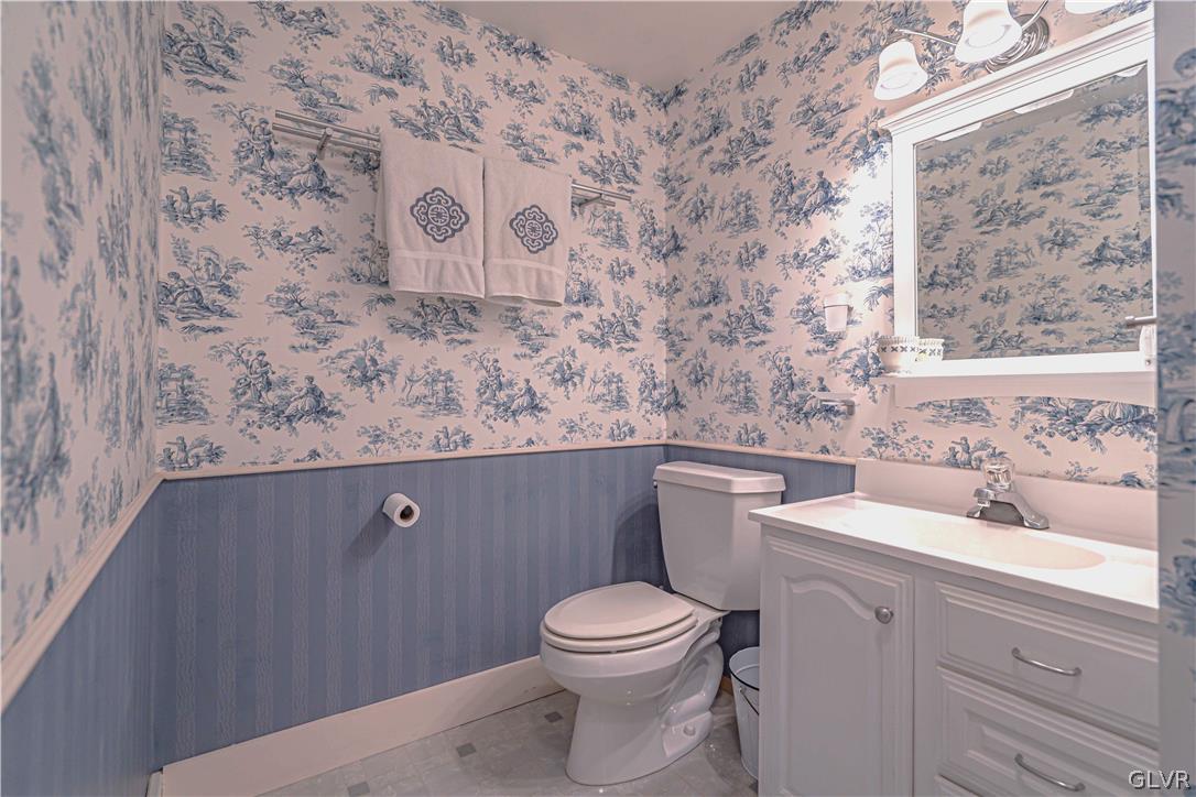 2884 Gallows Hill Road Riegelsville, PA 18077 - Photo 35 of 50 a bathroom with a toilet sink and mirror