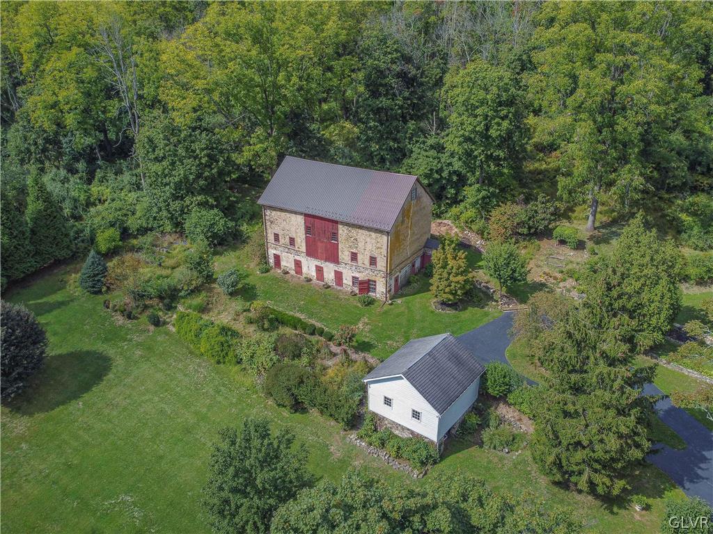 2884 Gallows Hill Road Riegelsville, PA 18077 - Photo 43 of 50 an aerial view of a house with pool garden and tall trees
