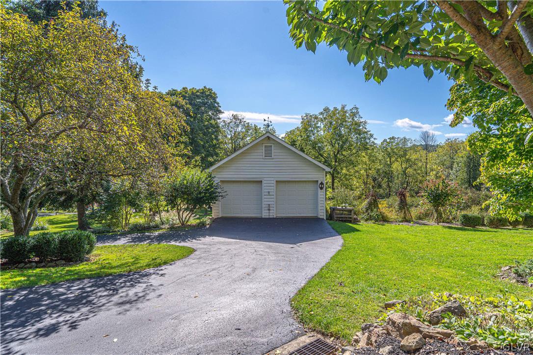 2884 Gallows Hill Road Riegelsville, PA 18077 - Photo 44 of 50 a view of a house with a yard and large tree