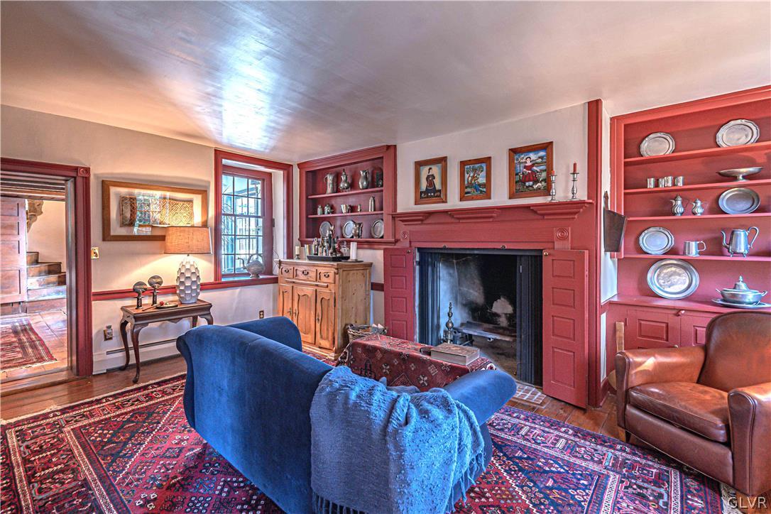 2884 Gallows Hill Road Riegelsville, PA 18077 - Photo 8 of 50 a living room with furniture wooden floor and a fireplace