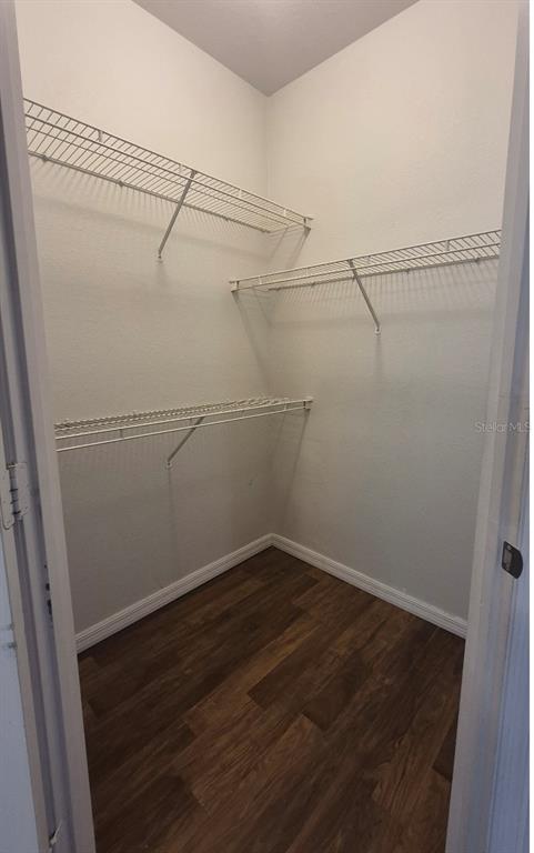 1990 Erving Circle, Unit 102 Ocoee, FL 34761 - Photo 12 of 28 a view of a room with racks on the wall