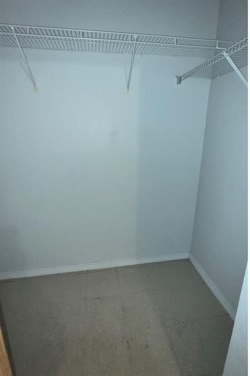 1990 Erving Circle, Unit 102 Ocoee, FL 34761 - Photo 19 of 28 a view of a room with racks on the wall