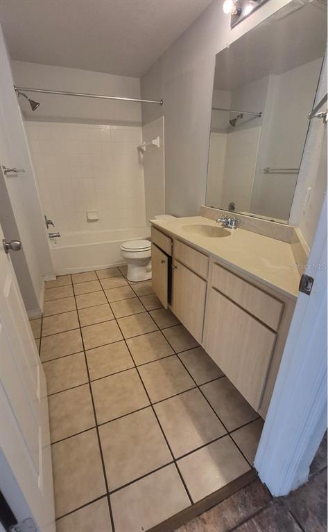 1990 Erving Circle, Unit 102 Ocoee, FL 34761 - Photo 20 of 28 a bathroom with a sink and a mirror