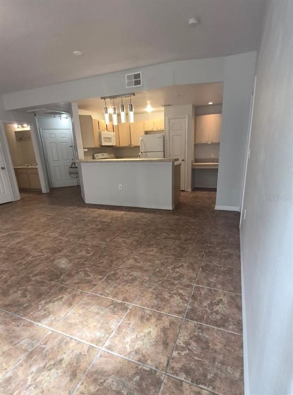 1990 Erving Circle, Unit 102 Ocoee, FL 34761 - Photo 3 of 28 an empty room with windows and entrance