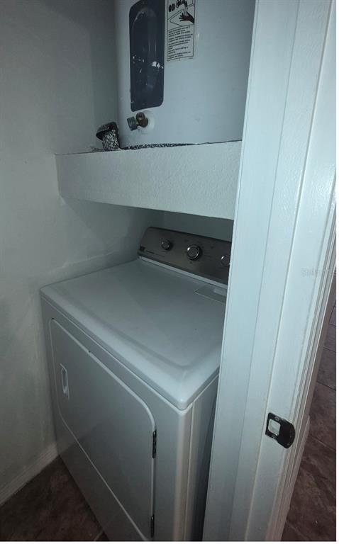 1990 Erving Circle, Unit 102 Ocoee, FL 34761 - Photo 10 of 28 a utility room with dryer and washer