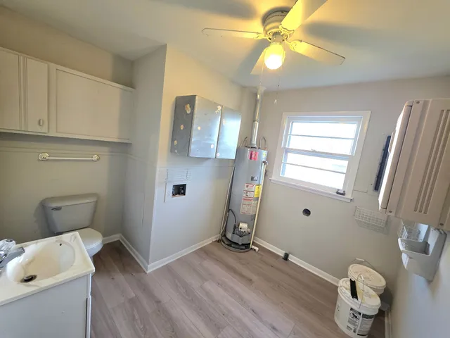 a room with a window and wooden floor