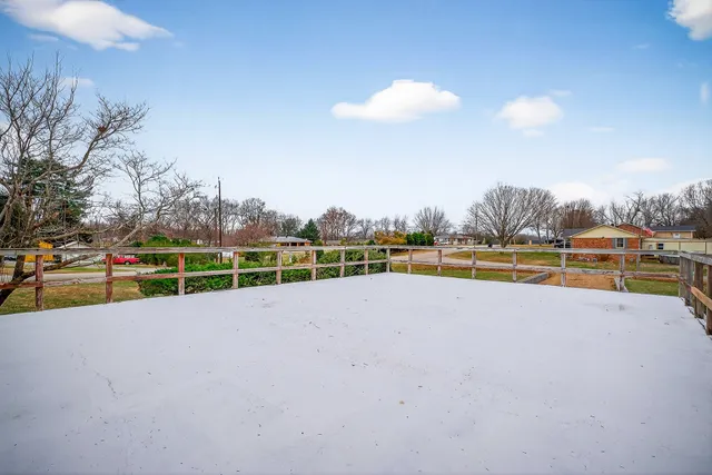 a view of a swimming pool with an outdoor space and seating area