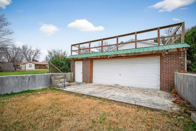 a front view of a house with a garage