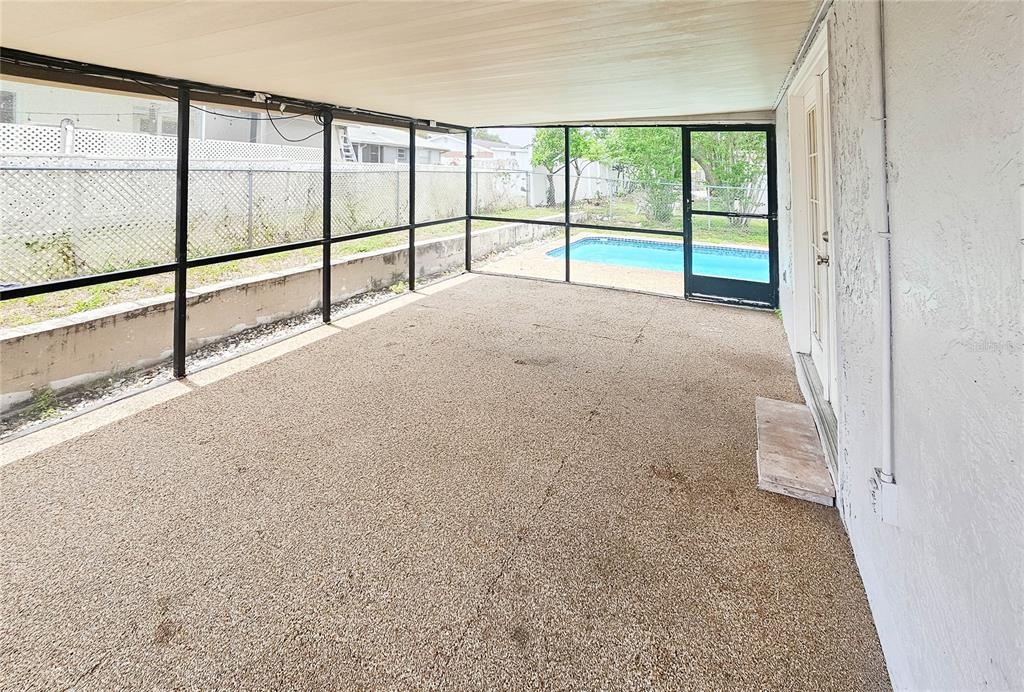 7304 Embassy Boulevard Port Richey, FL 34668 - Photo 14 of 14 a view of empty room with large windows