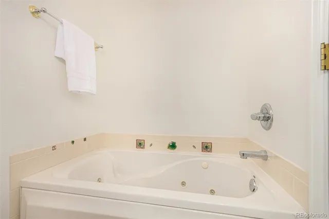 a white bath tub sitting in a bathroom