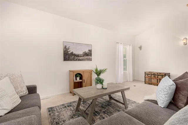 a living room with furniture and a couch