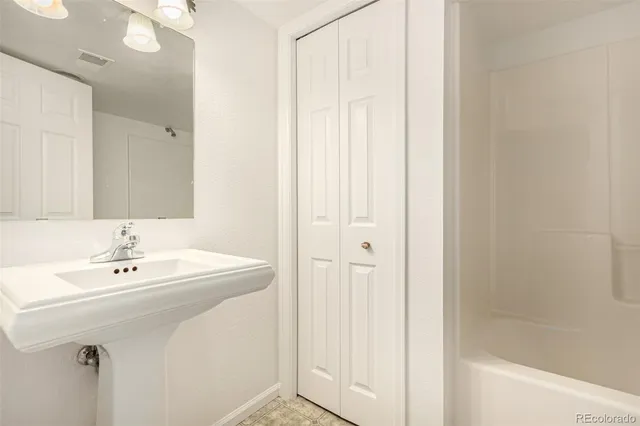 a bathroom with a sink and a bathtub