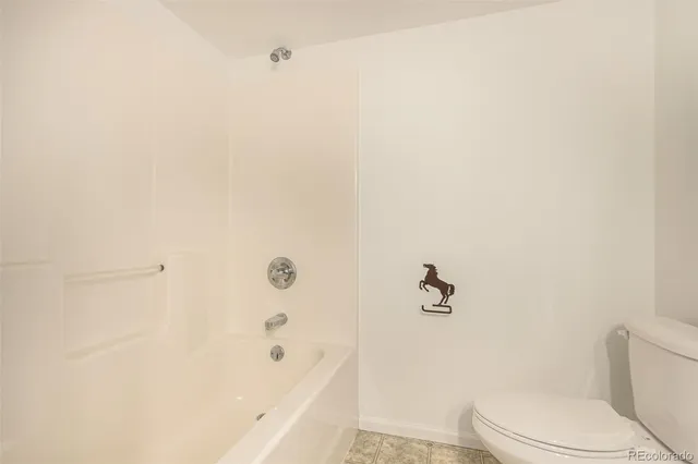 a bathroom with a bathtub and toilet