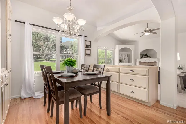 a view of a dining room with furniture window and wooden floor