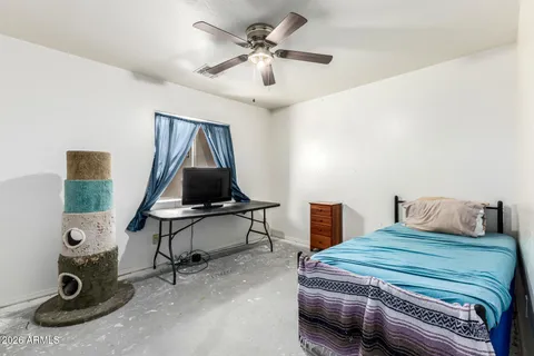a white toilet sitting next to a bathroom sink and vanity