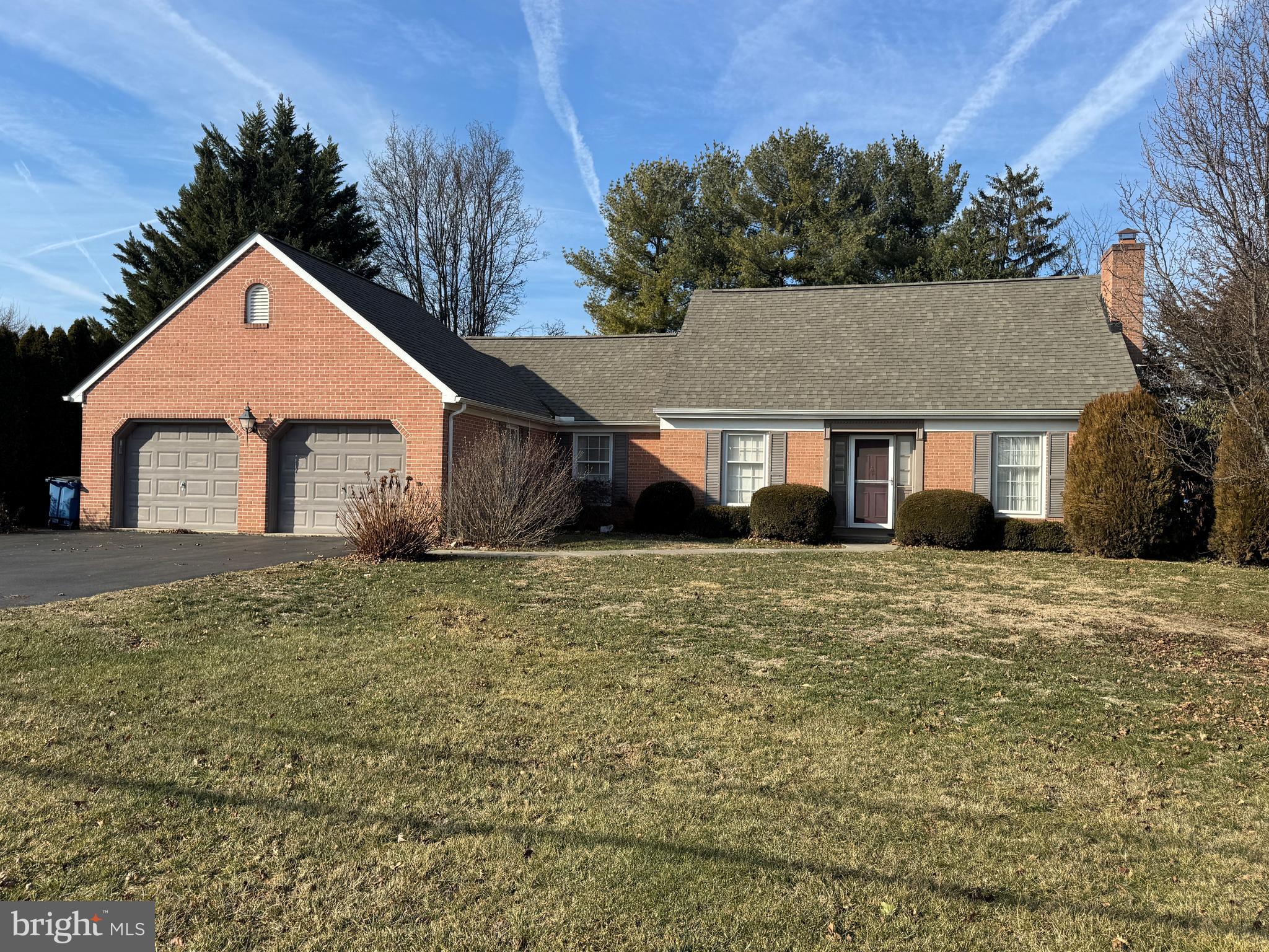 13632 Paradise Church Road Hagerstown, MD 21742 - Photo 1 of 47 a front view of a house with a yard and garage
