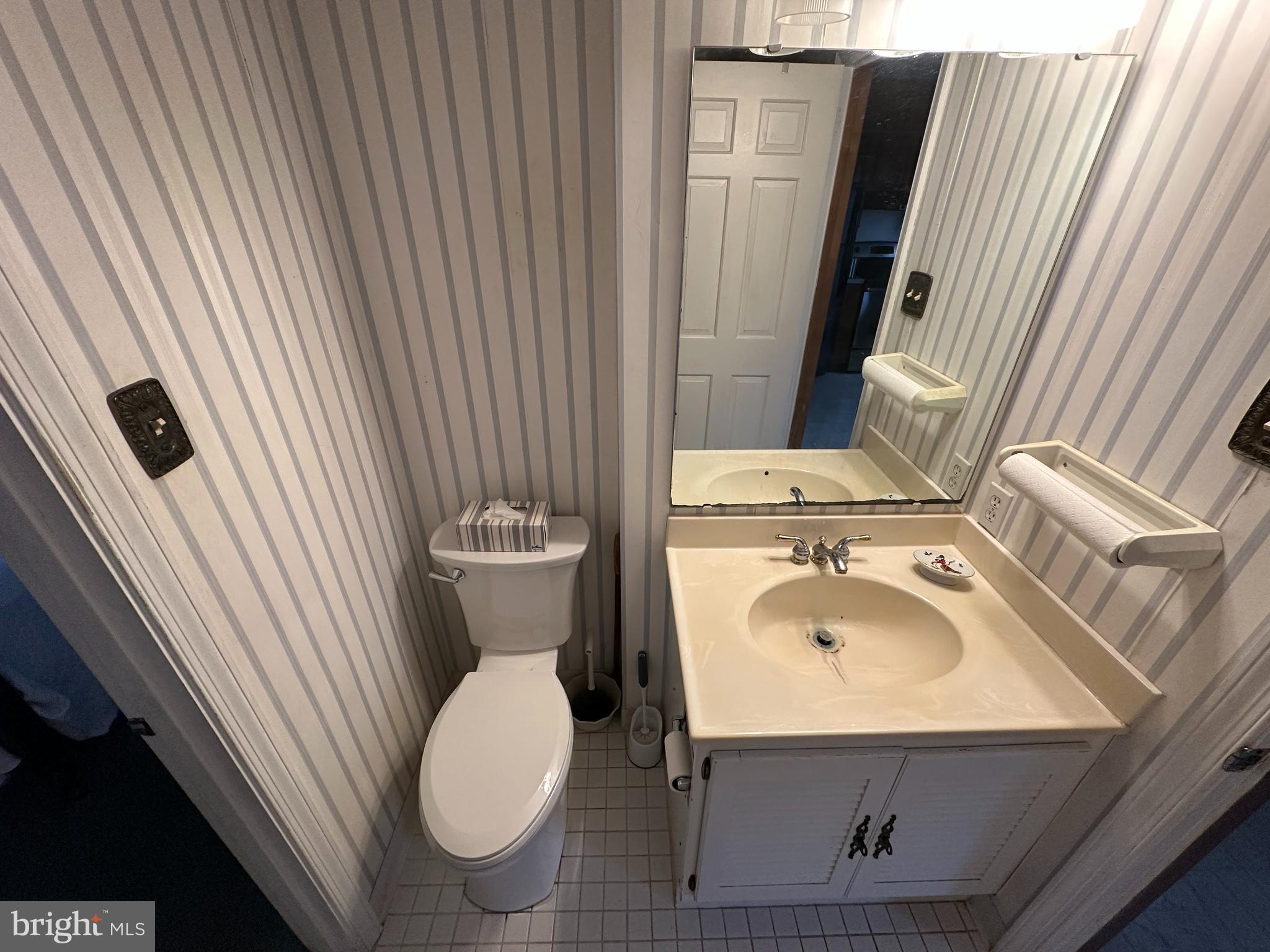 13632 Paradise Church Road Hagerstown, MD 21742 - Photo 19 of 47 a bathroom with a sink a toilet and mirror