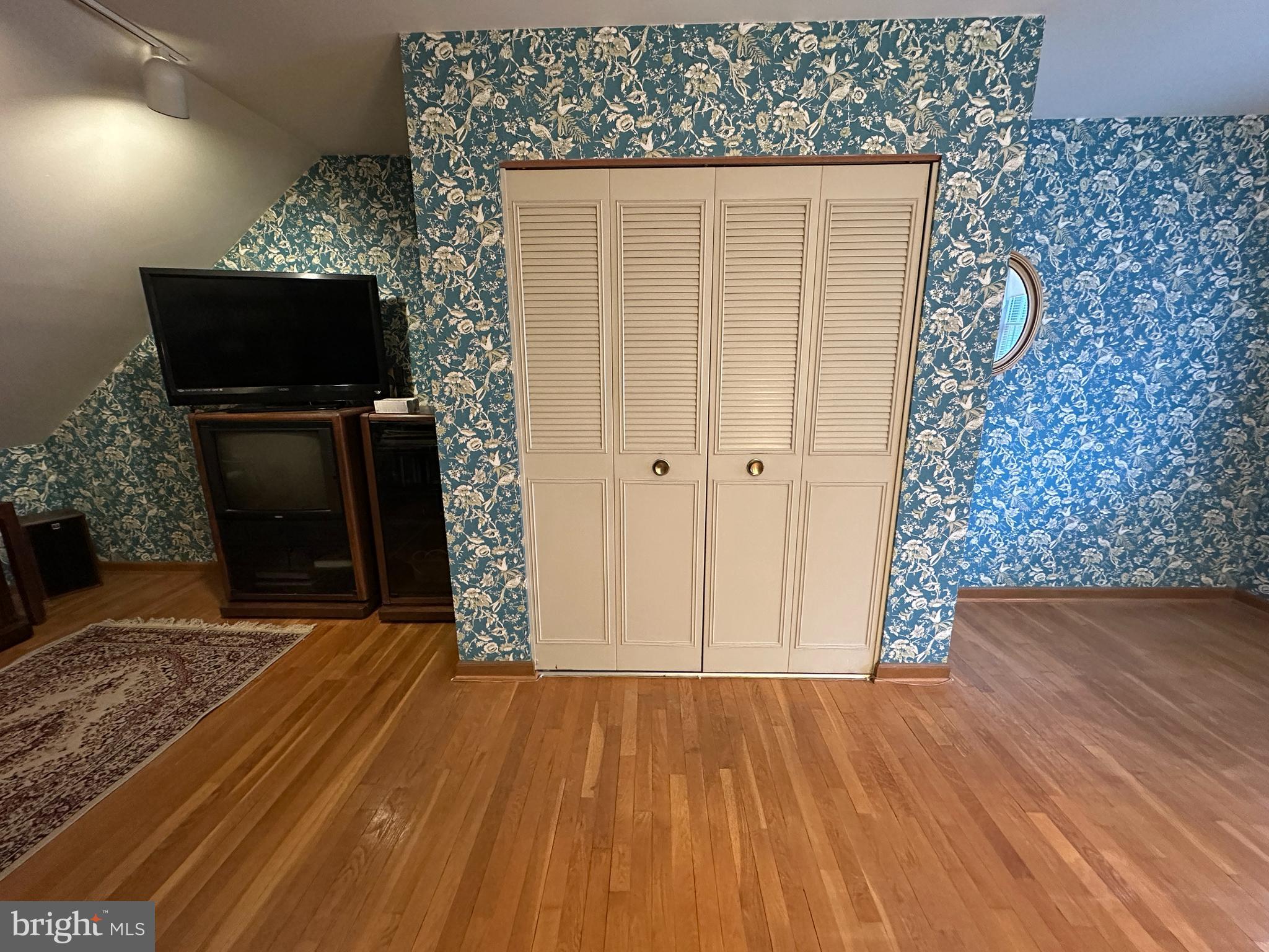 13632 Paradise Church Road Hagerstown, MD 21742 - Photo 31 of 47 a view of a livingroom with wooden floor and a flat screen tv