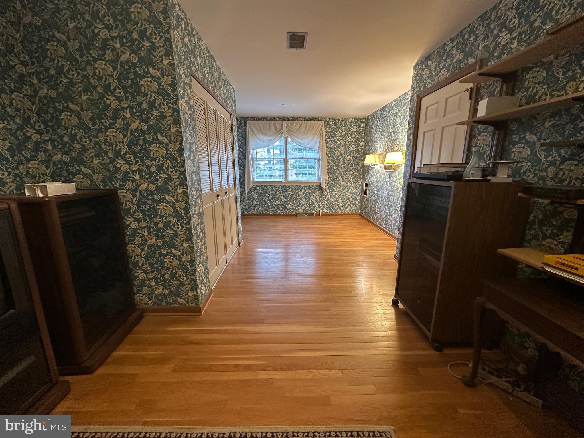 13632 Paradise Church Road Hagerstown, MD 21742 - Photo 35 of 47 a view of livingroom with hardwood floor and window