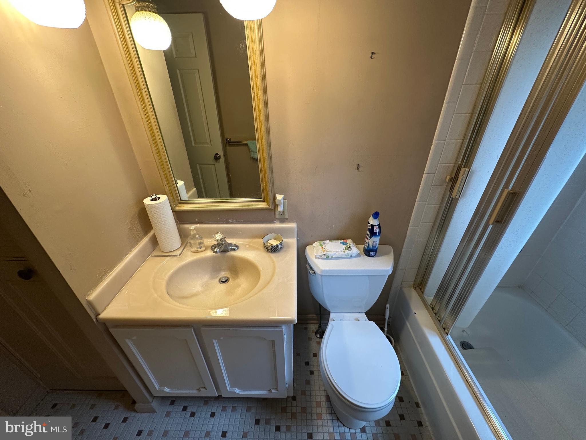 13632 Paradise Church Road Hagerstown, MD 21742 - Photo 37 of 47 a bathroom with a sink and mirror with toilet