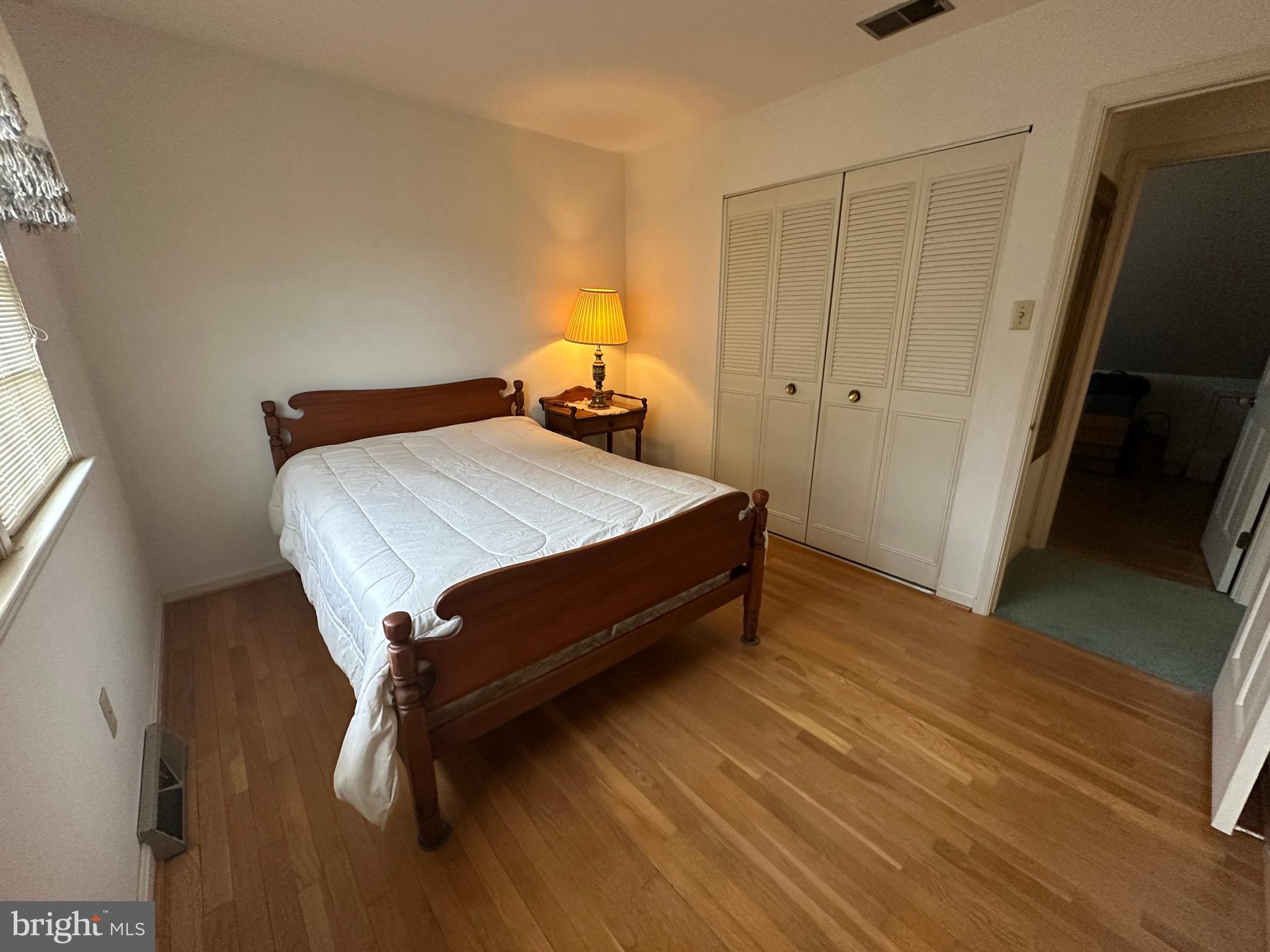 13632 Paradise Church Road Hagerstown, MD 21742 - Photo 40 of 47 a bedroom with a bed and wooden floor