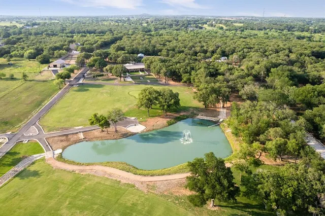 an aerial view of a house with a swimming pool
