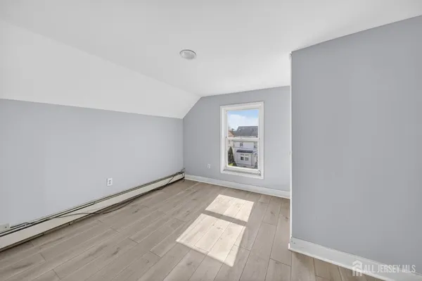 an empty room with wooden floor