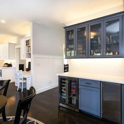 a kitchen with granite countertop a stove and cabinets