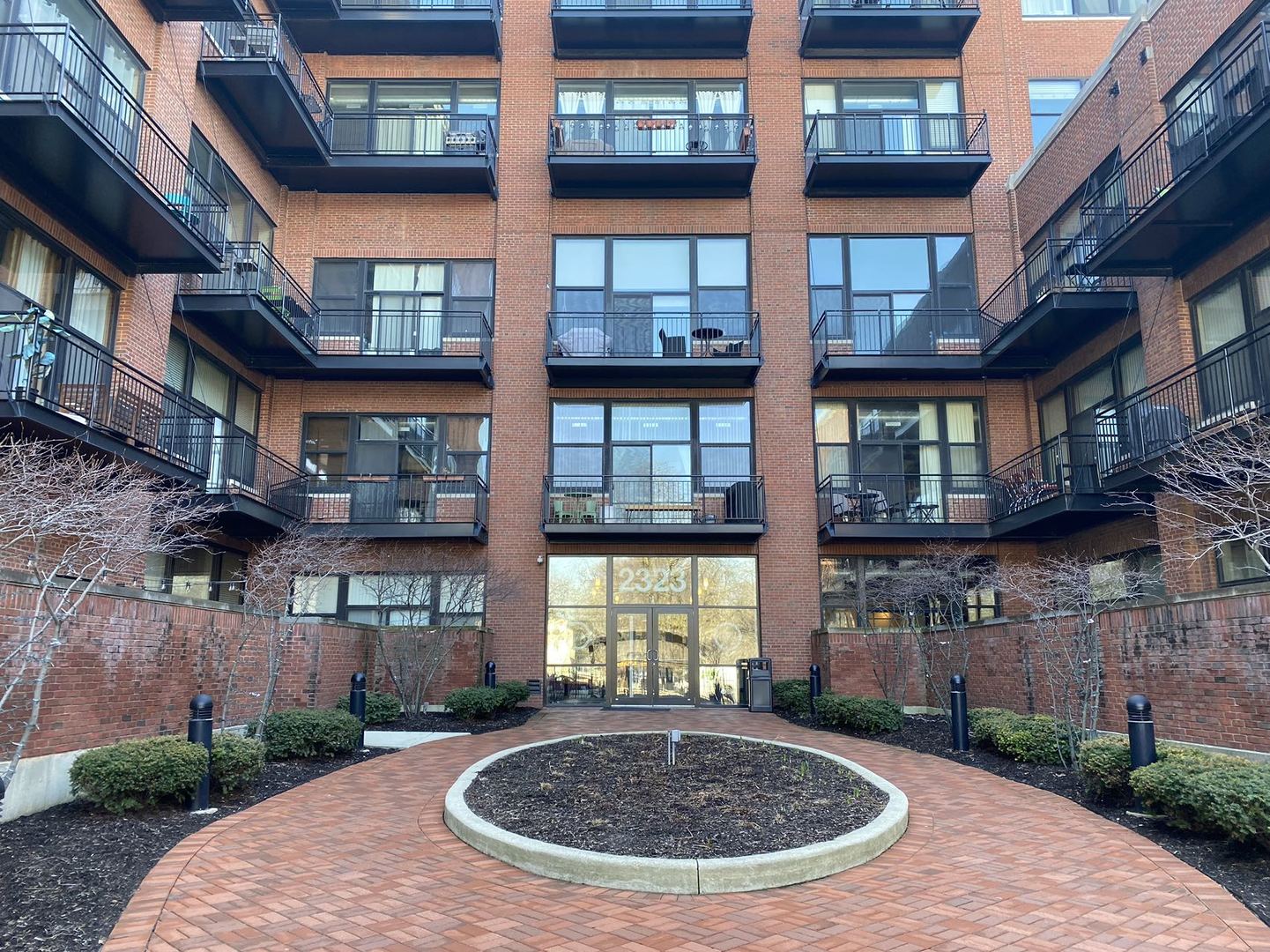2323 West Pershing Road, Unit 601 Chicago, IL 60609 - Photo 1 of 21 a view of a brick building with many windows