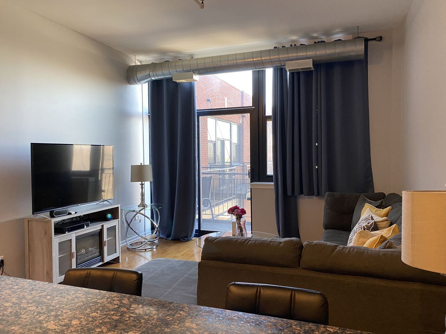 2323 West Pershing Road, Unit 601 Chicago, IL 60609 - Photo 16 of 21 a living room with furniture and a flat screen tv