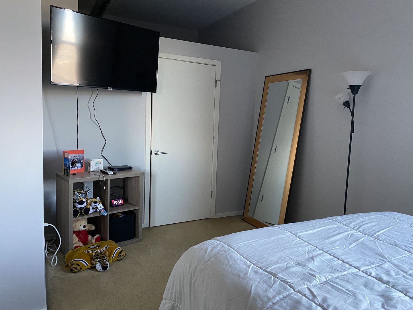 2323 West Pershing Road, Unit 601 Chicago, IL 60609 - Photo 18 of 21 a bedroom with a bed and a flat screen tv