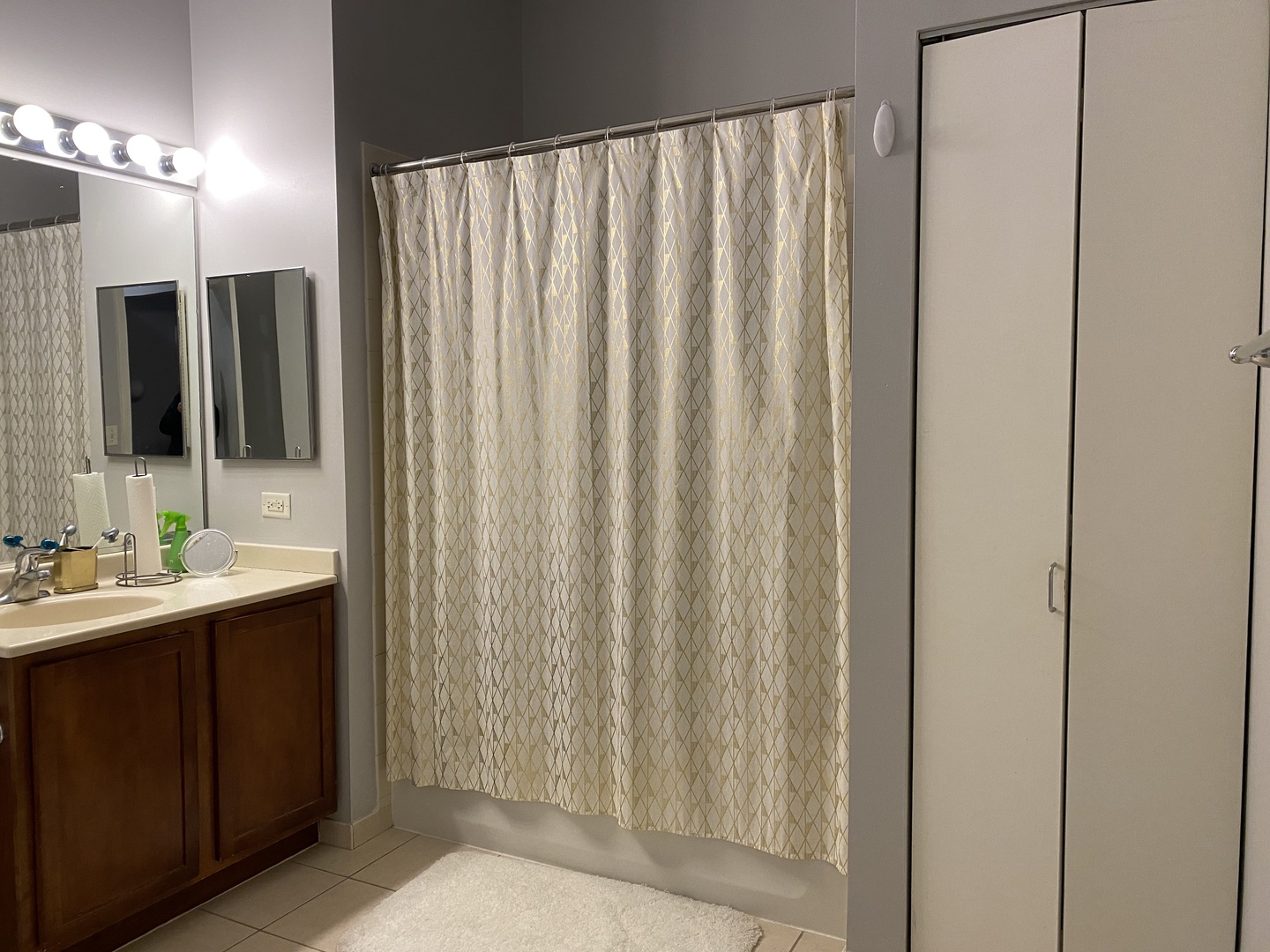 2323 West Pershing Road, Unit 601 Chicago, IL 60609 - Photo 20 of 21 a bathroom with a double vanity sink and mirror