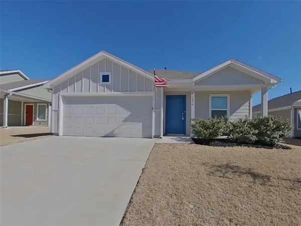 a front view of a house with yard