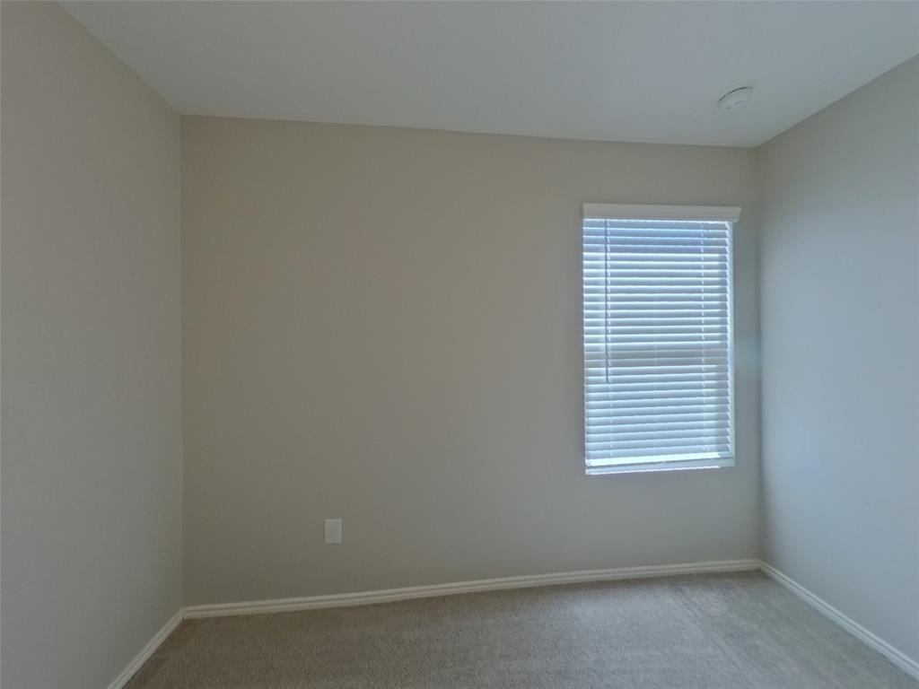 11856 Mancos Trail Rhome, TX 76078 - Photo 12 of 16 an empty room with a window