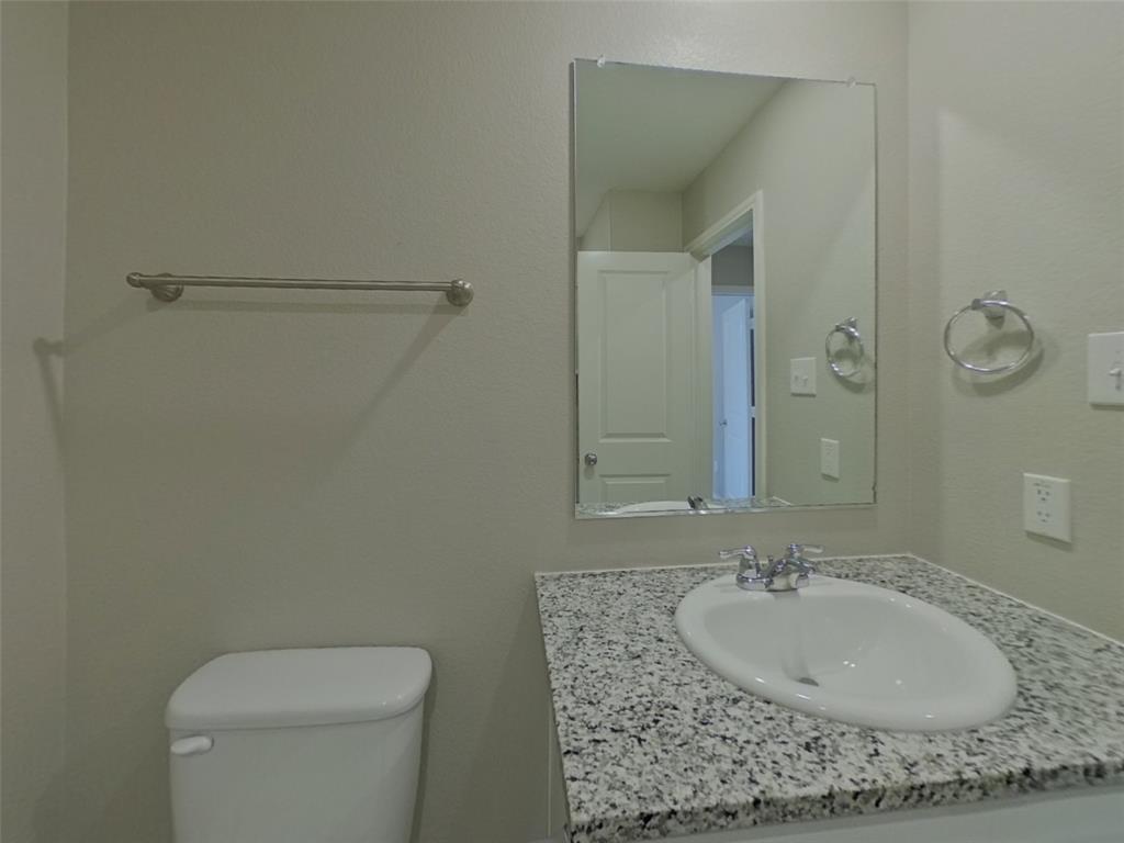 11856 Mancos Trail Rhome, TX 76078 - Photo 13 of 16 a bathroom with a sink and a mirror