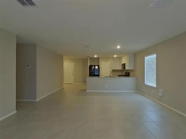 a view of kitchen and a window