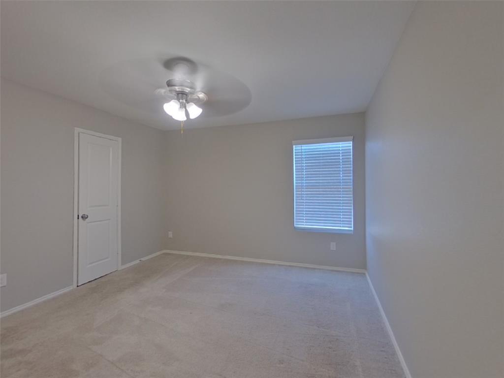 11856 Mancos Trail Rhome, TX 76078 - Photo 7 of 16 a view of an empty room with a window
