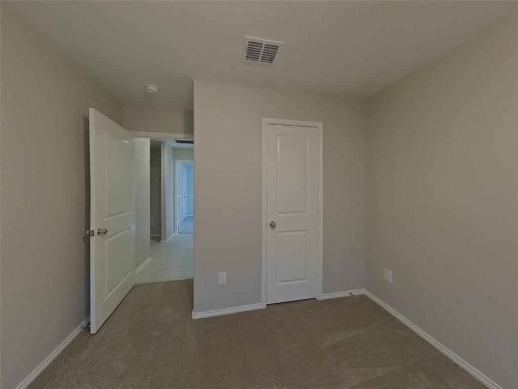 11856 Mancos Trail Rhome, TX 76078 - Photo 10 of 16 an empty room with closet