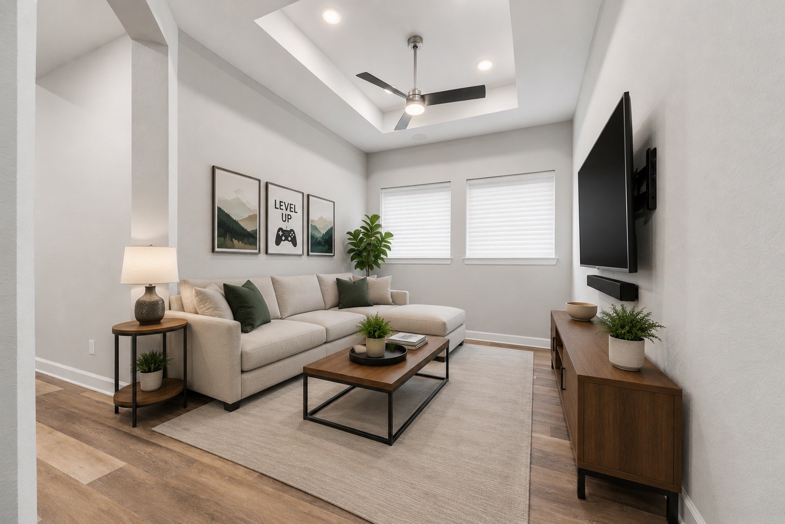 3438 Rich Radish Road Richmond, TX 77406 - Photo 8 of 25 This spacious multi-functional room features a decorative tray ceiling, a modern Kichler ceiling fan, a professionally installed TV wall mount, and direct wiring for sound. Virtually staged.