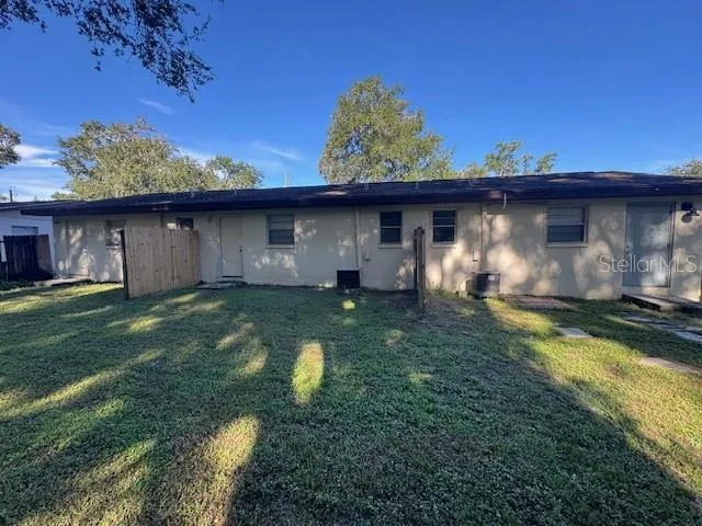 a view of a backyard with a tub