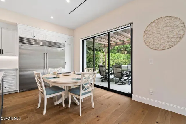 a kitchen with a sink a center island and cabinets