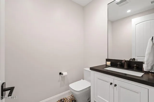 a bedroom with a bed couch and window