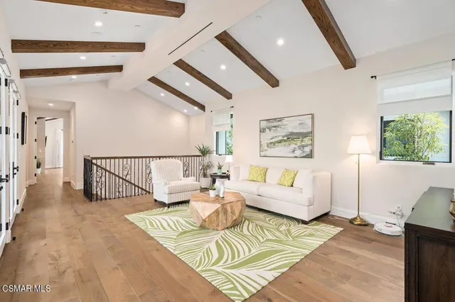 a spacious bathroom with a granite countertop sink mirror and bathtub