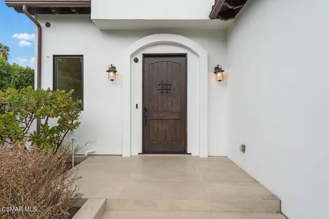 a view of entryway livingroom and hall with wooden floor