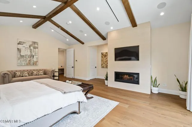 a spacious bathroom with a double vanity sink large mirror and a bathtub