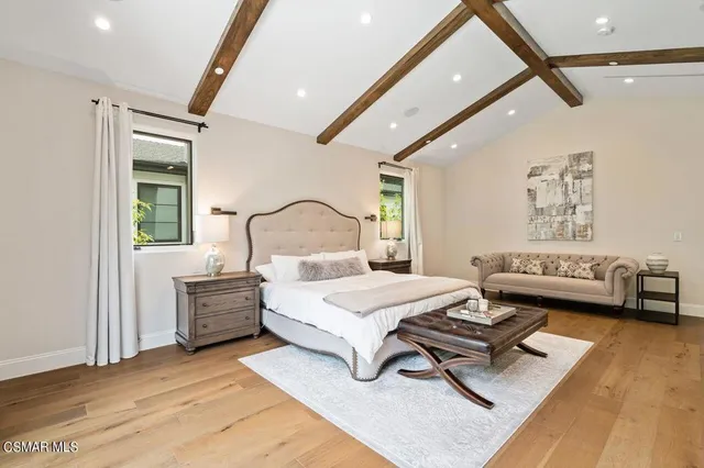 a bathroom with a granite countertop double vanity sink a large mirror and shower