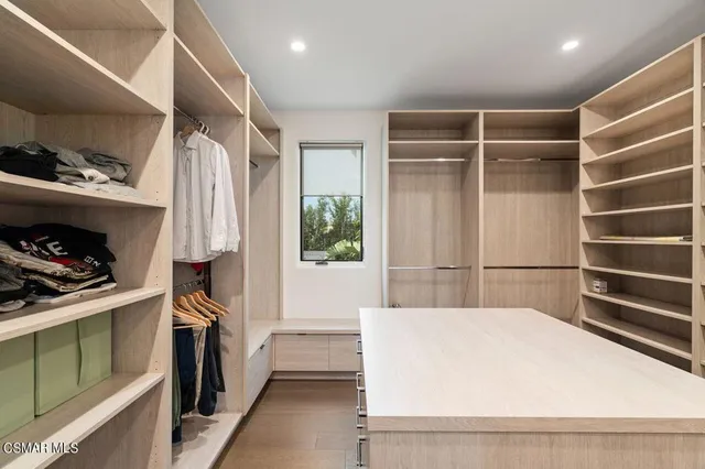 a building outdoor space with patio furniture and garden